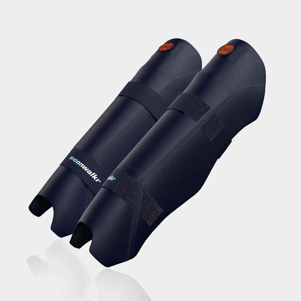 Moonwalkr Keeping Shin Guards close up of orange circular logo on navy blue shell at Alberta Cricket Store