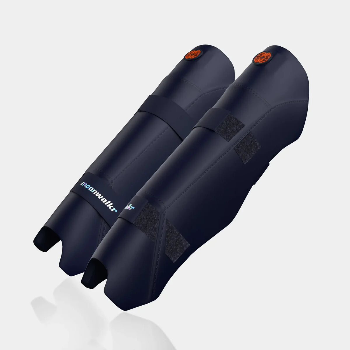 Moonwalkr Keeping Shin Guards close up of orange circular logo on navy blue shell at Alberta Cricket Store
