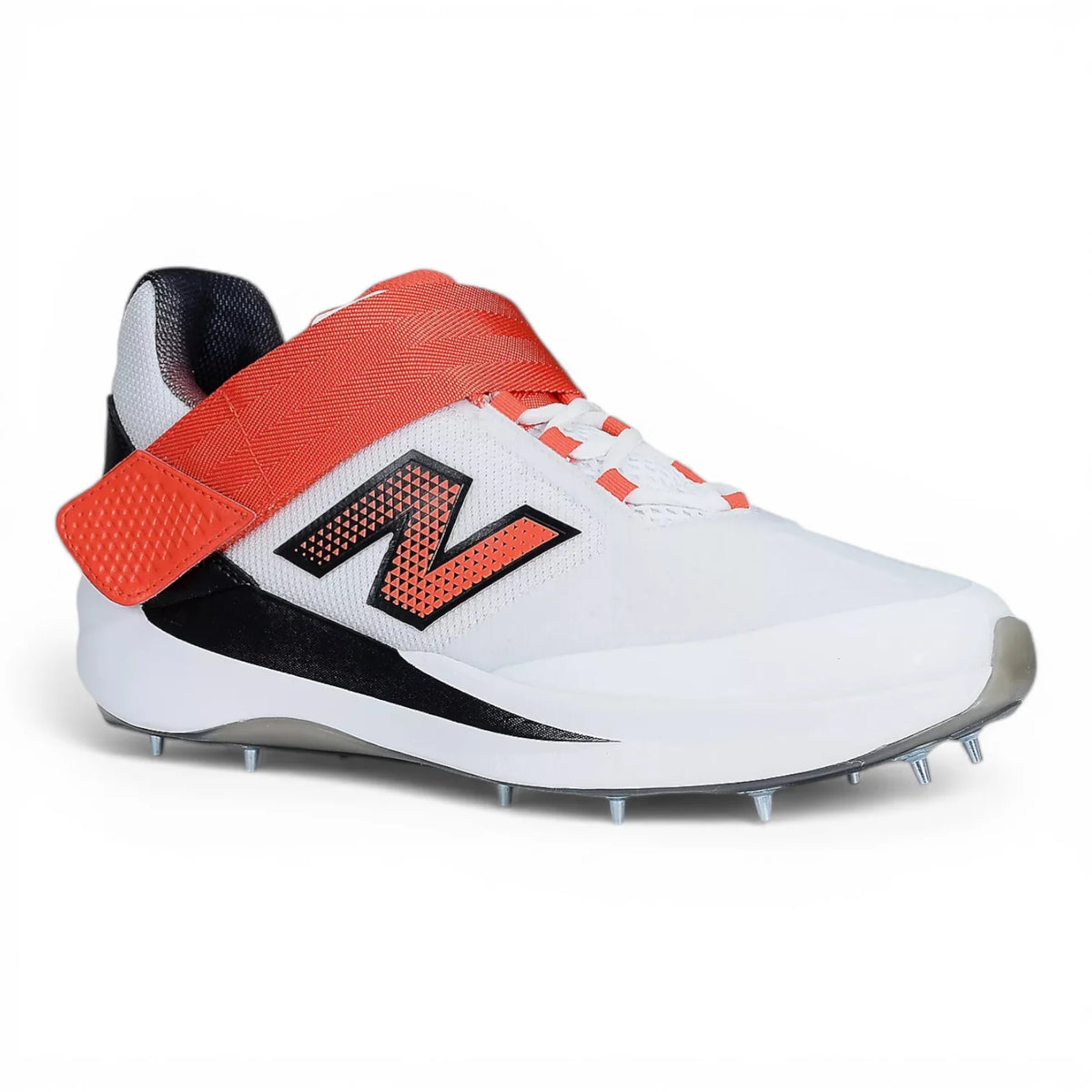 Side profile view of a white New Balance CK4040 F7 Cricket Shoe with a red midfoot mid-strap, black 'N' logo, and metal spike outsole.