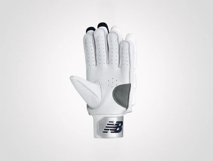 New Balance DC 10i Pro adult cricket batting gloves in white with New Balance logo on the wristband on albertacrickets.com.