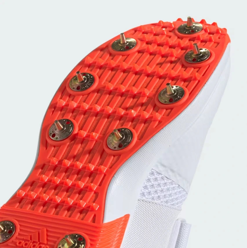 Close up of front orange outsole grid and steel spikes on Adidas Adipower Vector 2.0 Cricket Shoes - Alberta Cricket Store