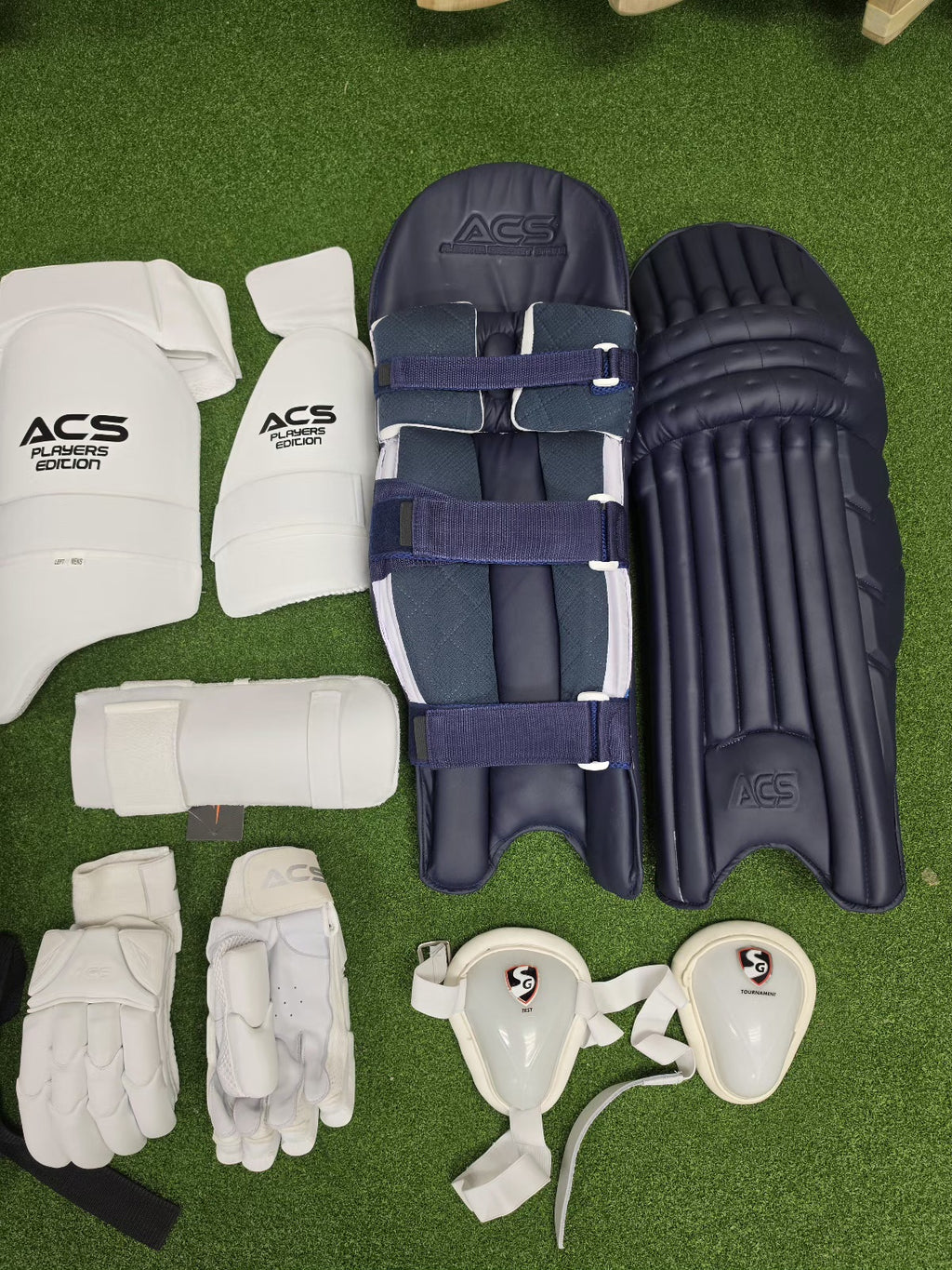 ACS navy blue cricket batting pads and protective gear set