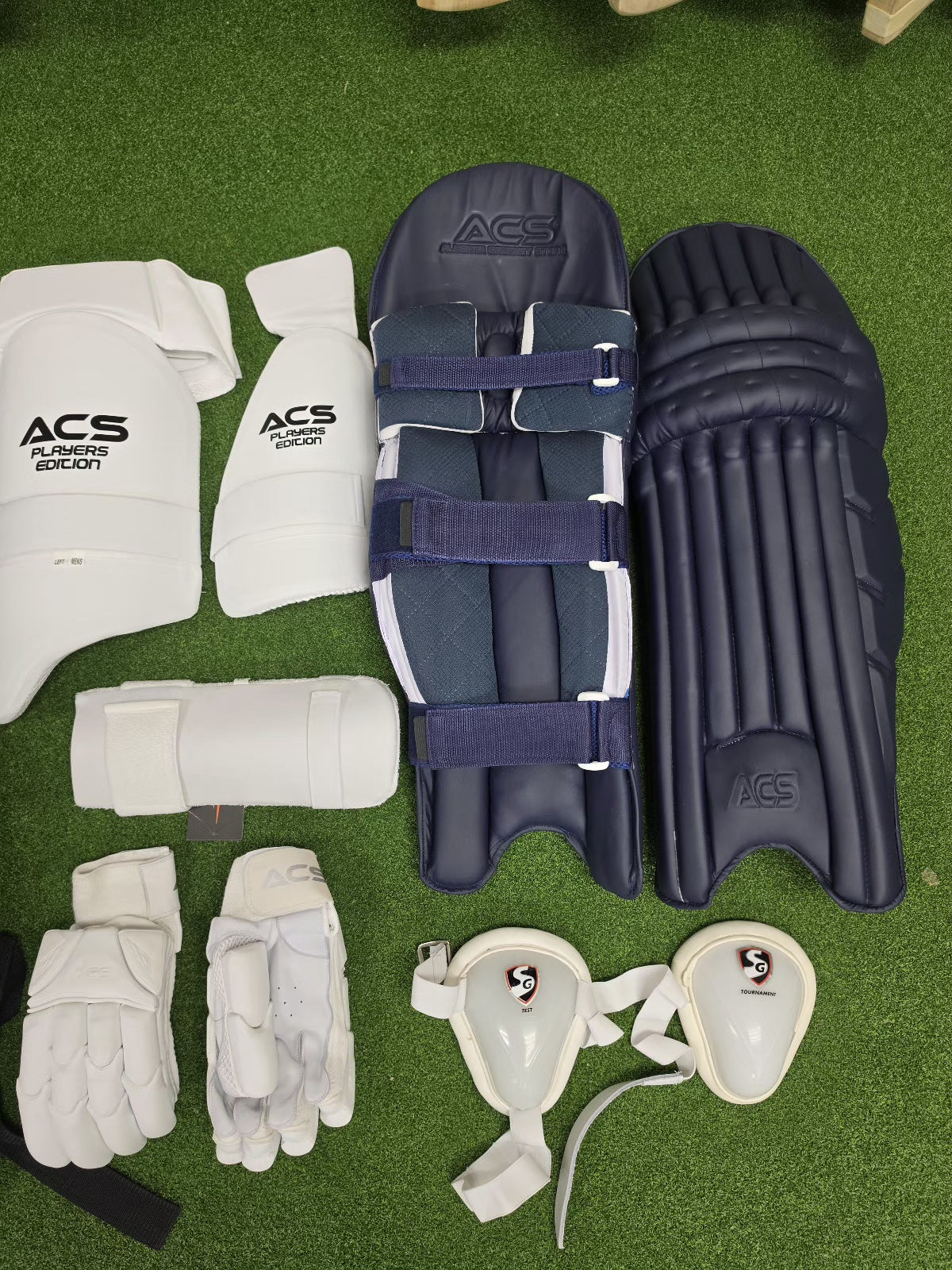 ACS navy blue cricket batting pads and protective gear set