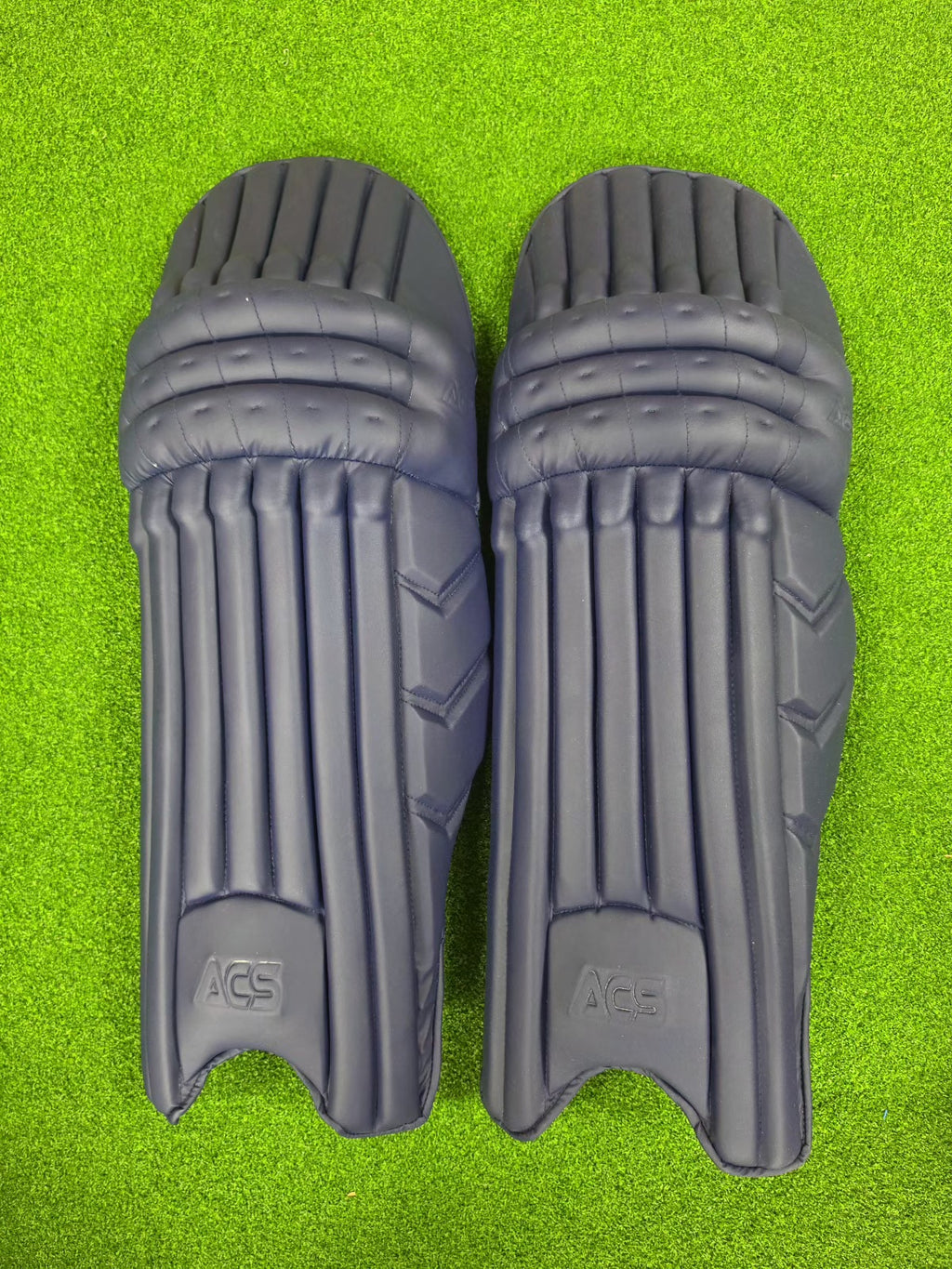 ACS Player Edition navy blue batting pads – front view