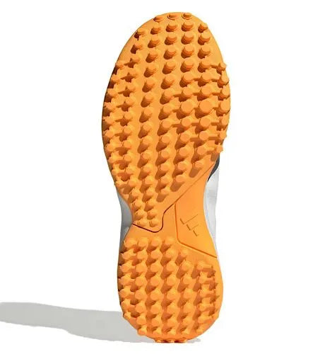 Bottom view of the orange textured outsole on an Adidas Howzat spikeless cricket shoe.