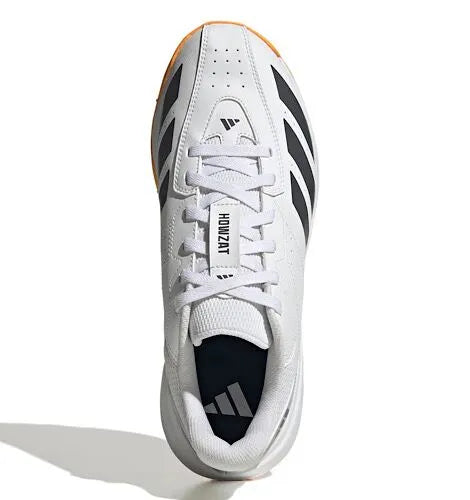 Top view of a white Adidas Howzat cricket shoe showing the laces, tongue and grey stripes.