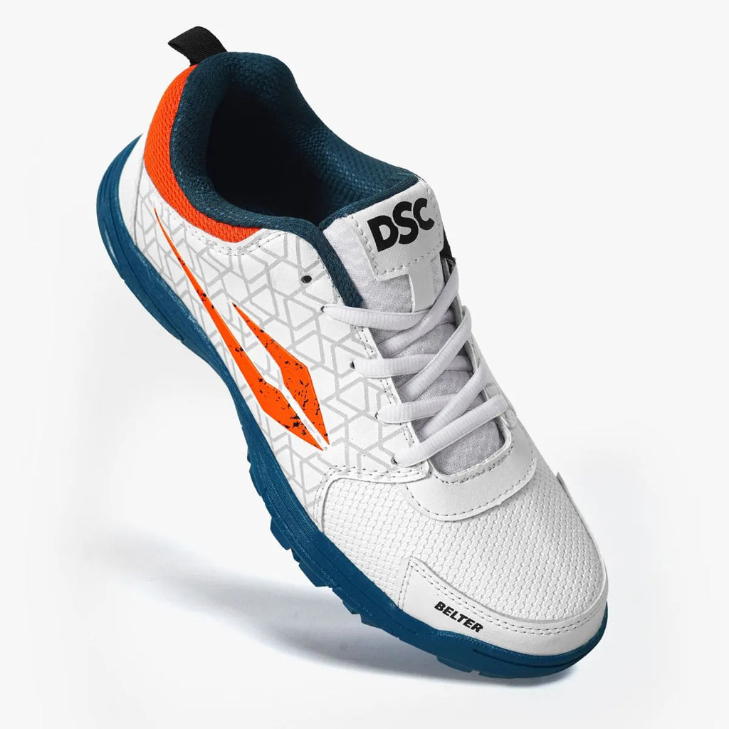 Three-quarter front perspective view of DSC Belter cricket shoe in white, orange, and teal.