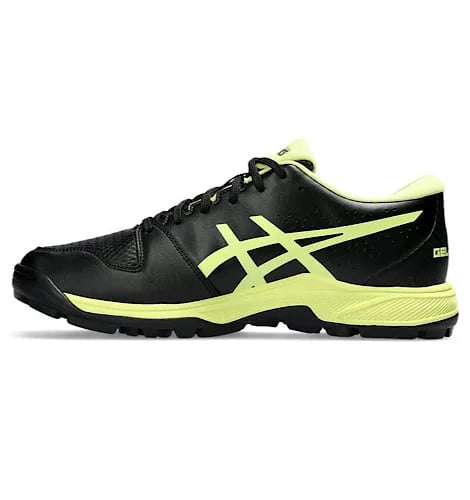 Medial side view of black Asics Gel-Peake 2 cricket shoe with neon lime logo detailing and black outsole