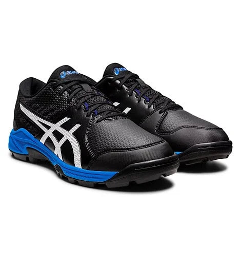 Front three-quarter view of black Asics Gel-Peake 2 cricket shoes with white side stripes and blue midsole trim.
