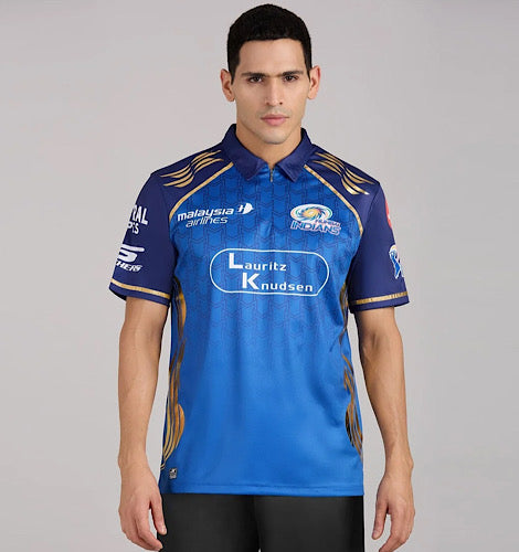 Front view of a model wearing a blue Mumbai Indians cricket jersey with gold detailing.