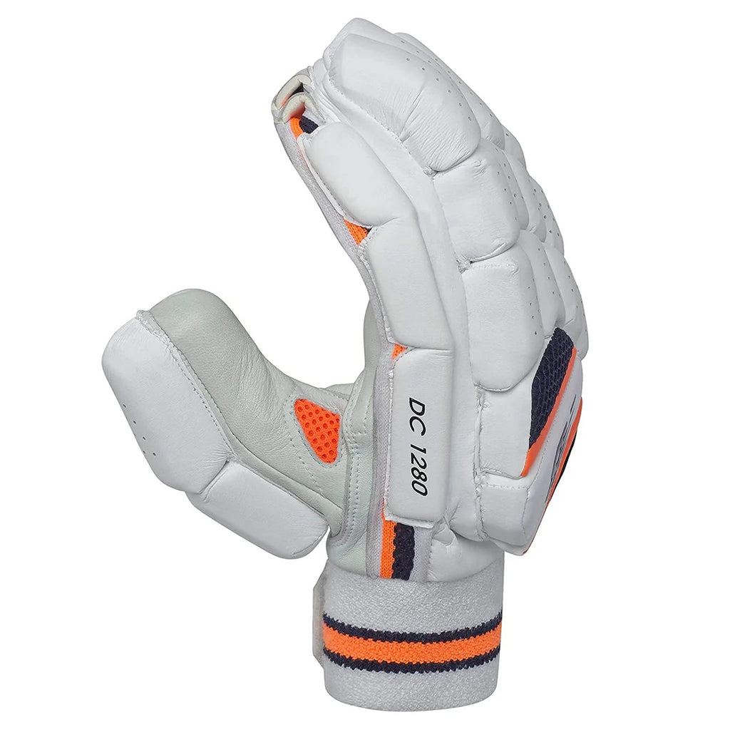 Side profile of a white New Balance DC 1280 cricket batting glove with orange and navy accents.