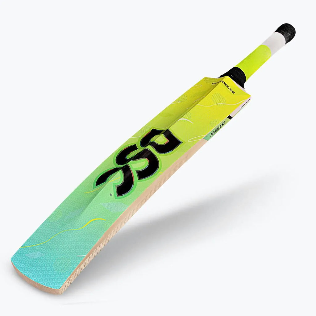 Angled front profile view of DSC Wildfire Warrior tennis cricket bat with vibrant lime green graphics and black DSC branding.